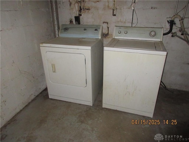 1329 Lamar Dr, Springfield, OH 45504 - clothes washing area featuring concrete block wall, washing machine and clothes dryer, and laundry area