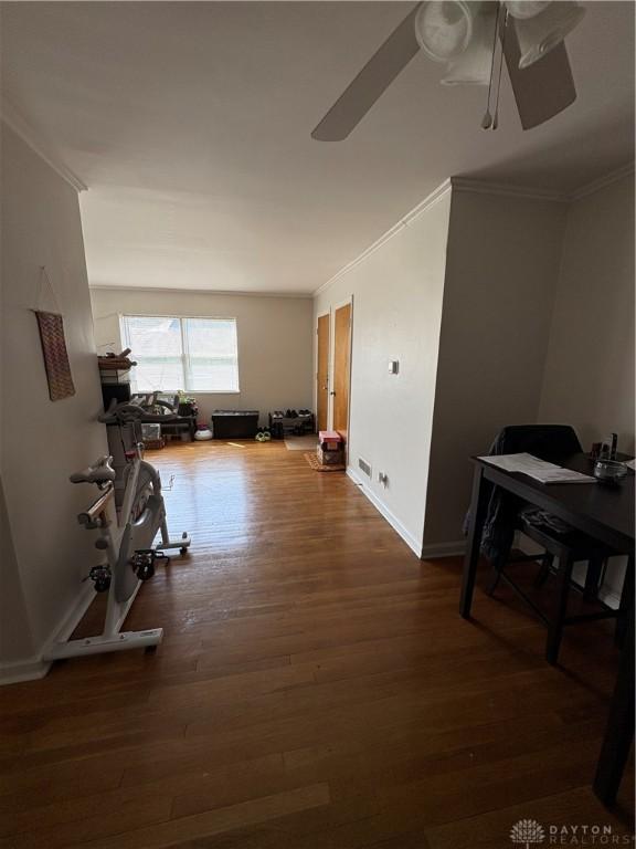 349 Orchard Dr, Oakwood, OH 45419 - corridor with wood finished floors, crown molding, and baseboards