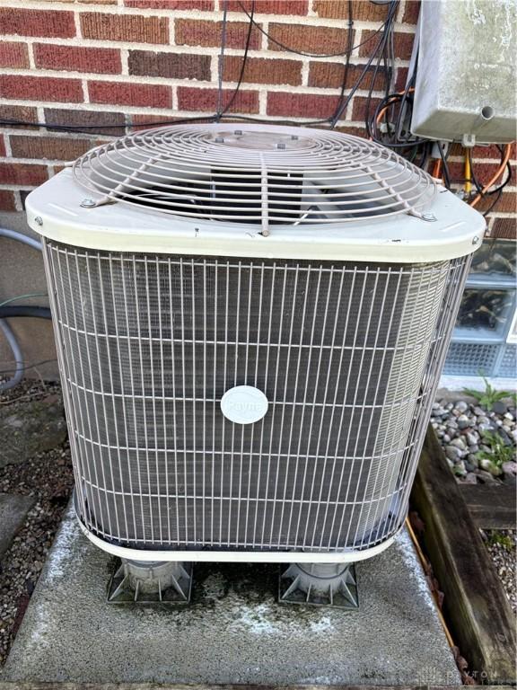 349 Orchard Dr, Oakwood, OH 45419 - exterior details with central AC unit