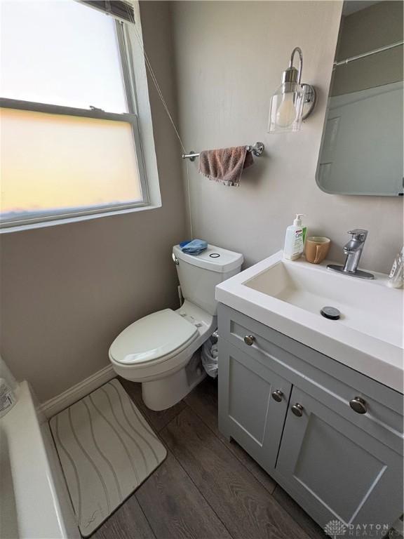 349 Orchard Dr, Oakwood, OH 45419 - bathroom with wood finished floors, a wealth of natural light, vanity, and toilet