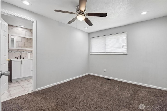 unfurnished room featuring light colored carpet, baseboards, a ceiling fan, and recessed lighting