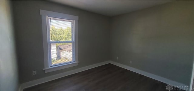 606 Creighton Ave, Dayton, OH 45410 - spare room featuring dark wood finished floors and baseboards