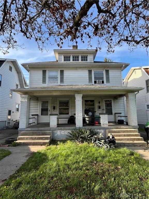 121-123 Knecht Dr, Dayton, OH 45405 - traditional style home with cooling unit and a porch