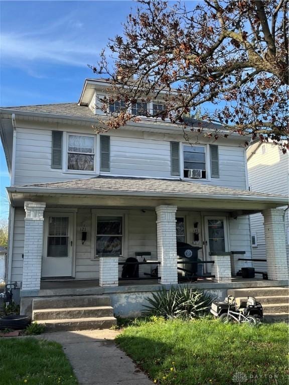 121-123 Knecht Dr, Dayton, OH 45405 - traditional style home with covered porch and brick siding
