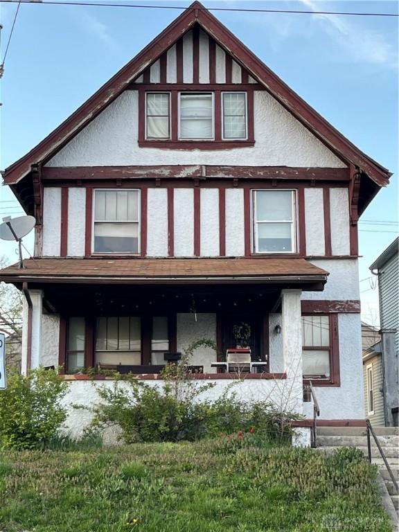 1049 Wyoming St, Dayton, OH 45410 - view of front of house with a porch and stucco siding