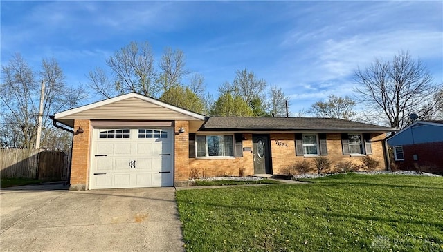 ranch-style house featuring fence, driveway, a front yard, and a garage