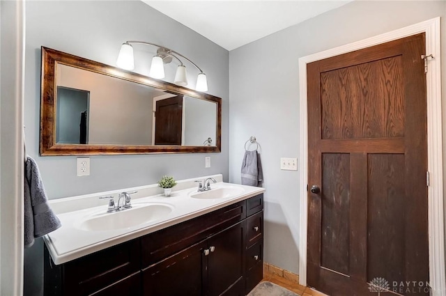 full bath featuring a sink and double vanity