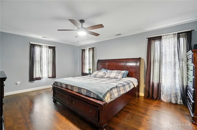 bedroom with visible vents, baseboards, and dark wood-type flooring