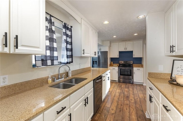 330 Rumson St, Englewood, OH 45322 - kitchen featuring recessed lighting, stainless steel appliances, a sink, and white cabinetry