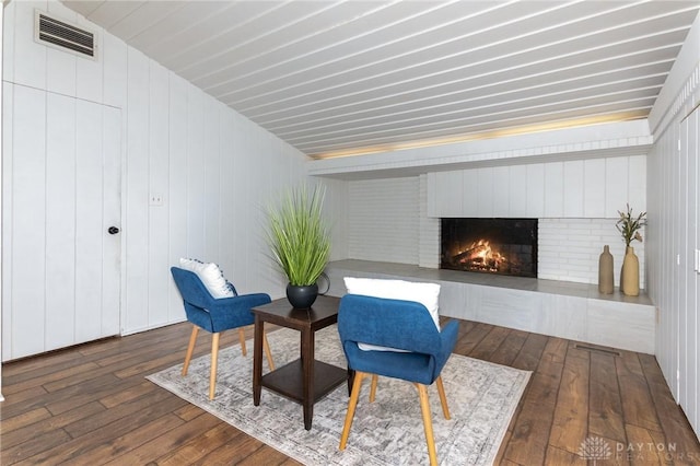 330 Rumson St, Englewood, OH 45322 - sitting room with dark wood finished floors, visible vents, and a brick fireplace