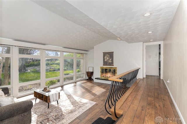 330 Rumson St, Englewood, OH 45322 - interior space featuring hardwood / wood-style flooring, a glass covered fireplace, baseboards, lofted ceiling, and recessed lighting