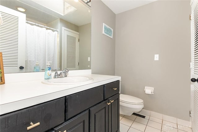 330 Rumson St, Englewood, OH 45322 - full bath with tile patterned floors, toilet, visible vents, baseboards, and vanity