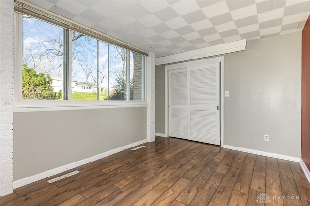 330 Rumson St, Englewood, OH 45322 - unfurnished bedroom featuring baseboards, visible vents, dark wood-type flooring, and a closet