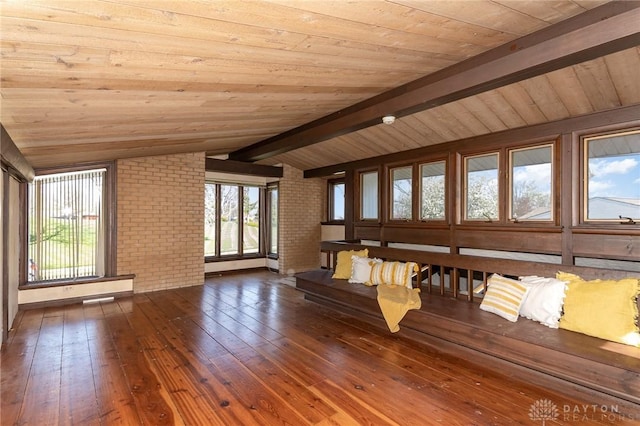 330 Rumson St, Englewood, OH 45322 - unfurnished living room featuring wood ceiling, brick wall, hardwood / wood-style flooring, and vaulted ceiling with beams