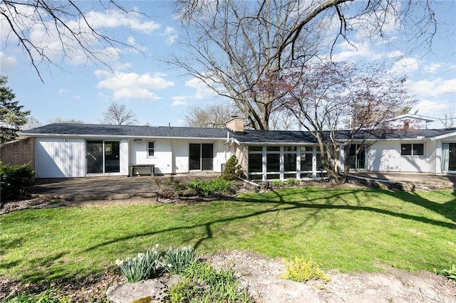 330 Rumson St, Englewood, OH 45322 - rear view of house with a chimney, a yard, and a patio