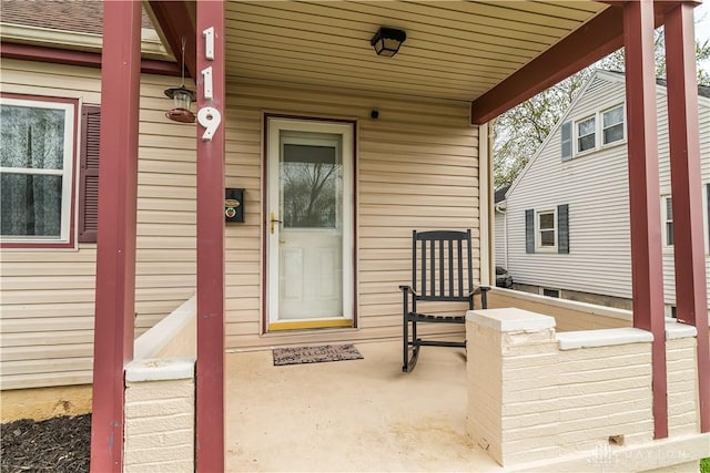 property entrance featuring covered porch