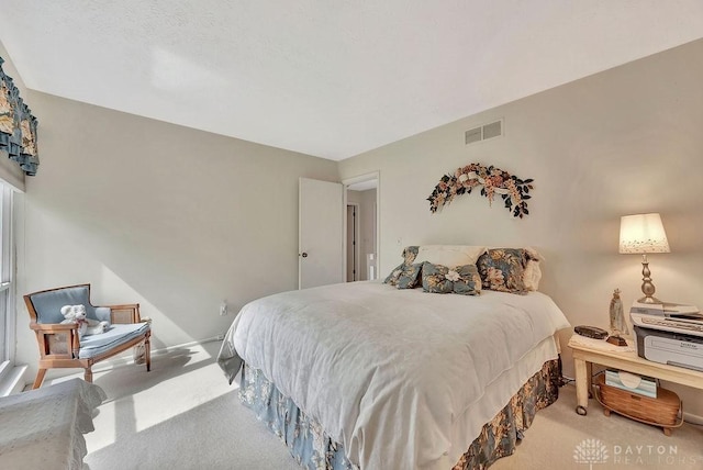 bedroom featuring visible vents and carpet