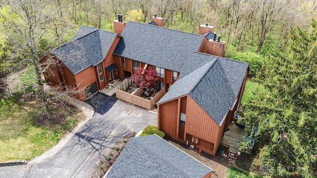 aerial view featuring a view of trees