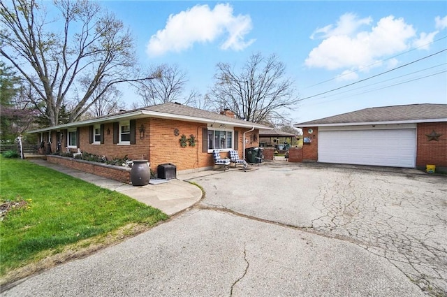 view of front of property with brick siding, a front yard, and a chimney