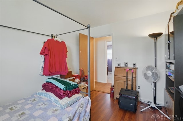 bedroom with wood finished floors