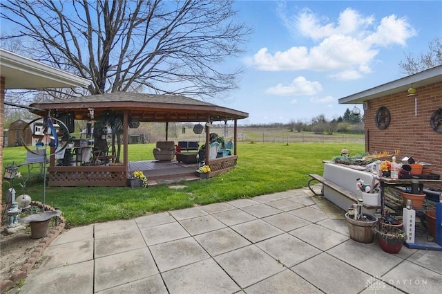 view of patio with a wooden deck and a gazebo