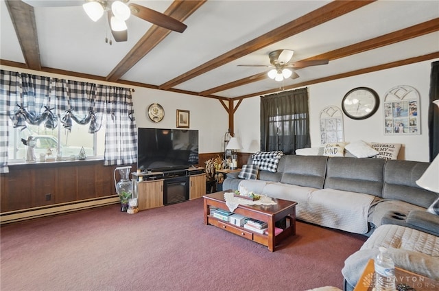 carpeted living area featuring beamed ceiling, a ceiling fan, baseboard heating, and wainscoting