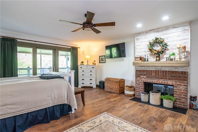 6475 Landsend Ct, Butler Township, OH 45414 - bedroom featuring a ceiling fan, a brick fireplace, wood finished floors, and recessed lighting