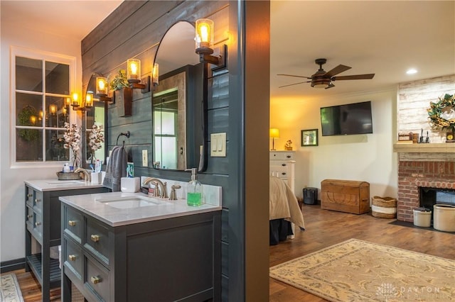 6475 Landsend Ct, Butler Township, OH 45414 - full bathroom featuring wood finished floors, a sink, and ceiling fan with notable chandelier