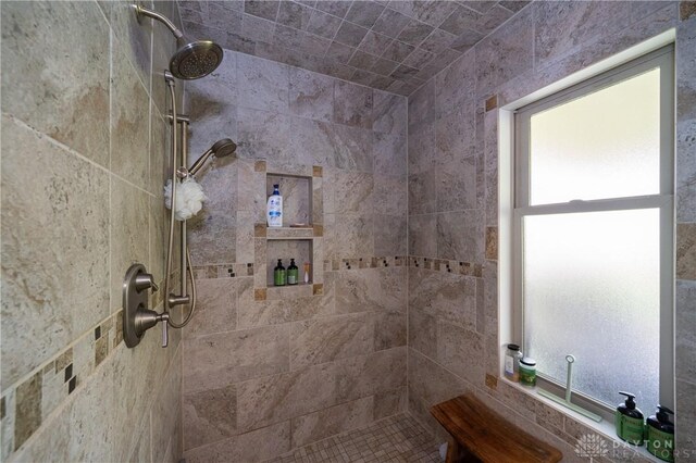 6475 Landsend Ct, Butler Township, OH 45414 - bathroom with a healthy amount of sunlight and tiled shower