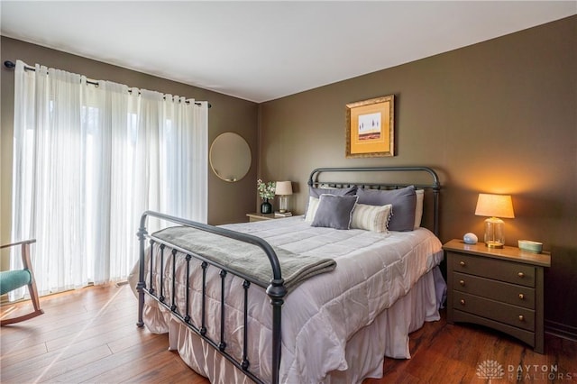 6475 Landsend Ct, Butler Township, OH 45414 - bedroom with wood-type flooring and multiple windows
