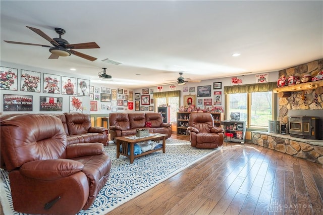 6475 Landsend Ct, Butler Township, OH 45414 - living room with hardwood / wood-style floors, ceiling fan, a wood stove, visible vents, and recessed lighting