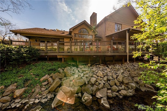 6475 Landsend Ct, Butler Township, OH 45414 - rear view of house with a chimney, brick siding, and a deck