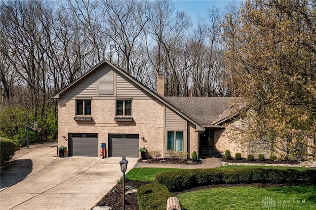 6475 Landsend Ct, Butler Township, OH 45414 - view of front of house featuring driveway, a chimney, brick siding, an attached garage, and a front yard