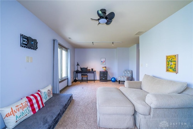 6475 Landsend Ct, Butler Township, OH 45414 - living room featuring rail lighting, visible vents, light colored carpet, and ceiling fan