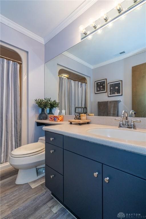 6475 Landsend Ct, Butler Township, OH 45414 - bathroom with wood finished floors, visible vents, toilet, vanity, and ornamental molding