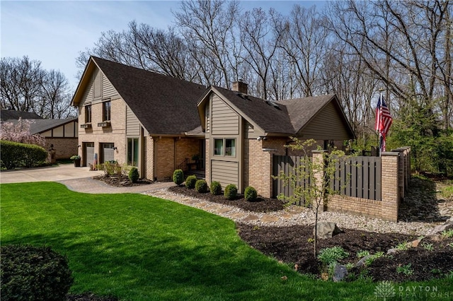 6475 Landsend Ct, Butler Township, OH 45414 - view of front of home with fence, roof with shingles, driveway, brick siding, and a front yard