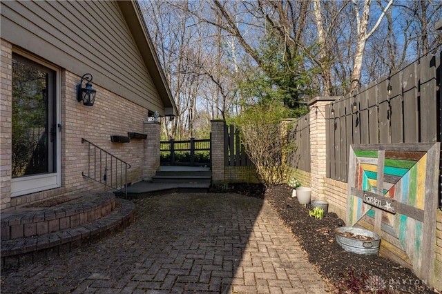 6475 Landsend Ct, Butler Township, OH 45414 - view of side of home with brick siding and fence