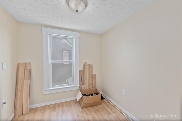 40 E Pease Ave, Dayton, OH 45449 - interior space with wood finished floors, a textured ceiling, and baseboards