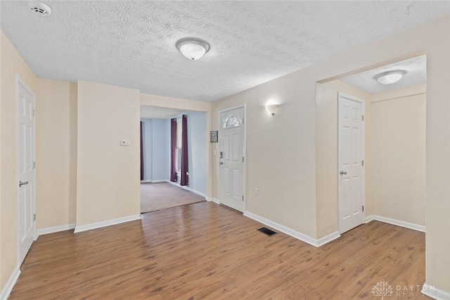 40 E Pease Ave, Dayton, OH 45449 - foyer with a textured ceiling, wood finished floors, visible vents, and baseboards