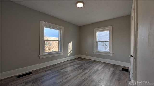 1105 Pursell Ave, Dayton, OH 45420 - spare room with baseboards and wood finished floors