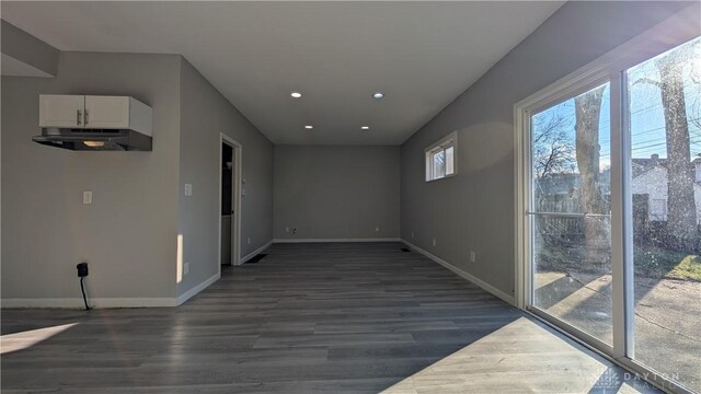 1105 Pursell Ave, Dayton, OH 45420 - empty room with dark wood-type flooring and recessed lighting