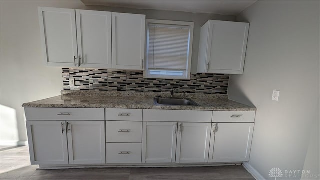 1105 Pursell Ave, Dayton, OH 45420 - kitchen featuring decorative backsplash and white cabinets