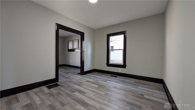 1105 Pursell Ave, Dayton, OH 45420 - spare room featuring wood finished floors and baseboards