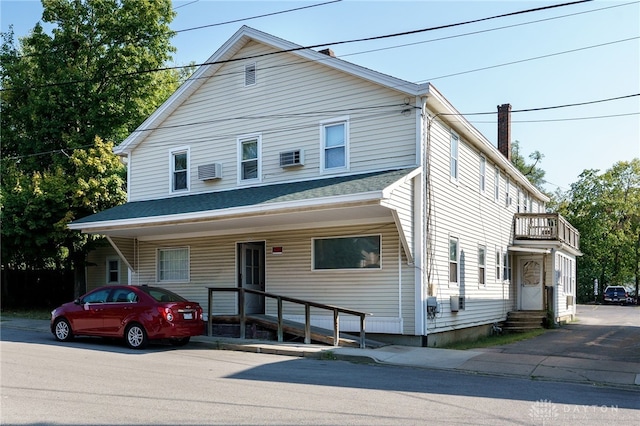 115 Sycamore St, Brookville, OH 45309 - traditional style home with entry steps, a balcony, and a chimney