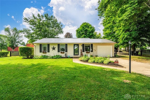 4065 Apache Trl, Jamestown Vlg, OH 45335 - ranch-style home featuring concrete driveway, an attached garage, and metal roof