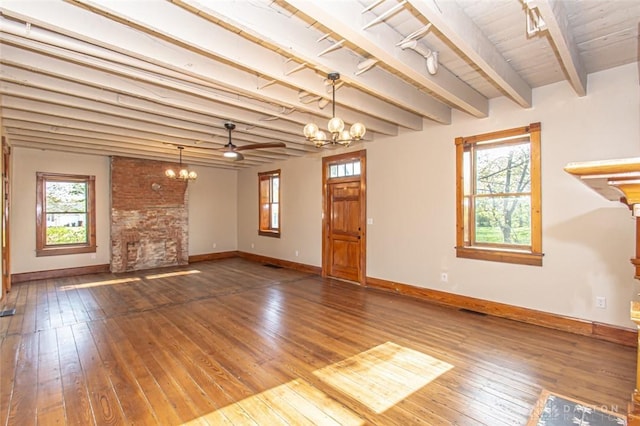 117 Montgomery Ave, Franklin, OH 45005 - unfurnished living room with plenty of natural light, beam ceiling, and wood-type flooring