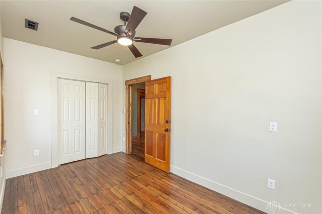 117 Montgomery Ave, Franklin, OH 45005 - unfurnished bedroom with hardwood / wood-style floors, baseboards, visible vents, and a closet