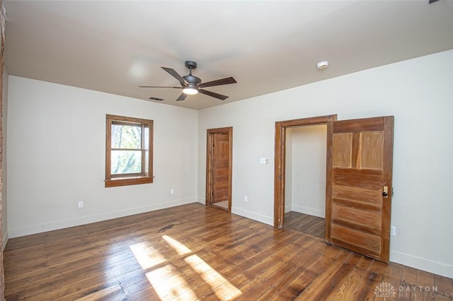 117 Montgomery Ave, Franklin, OH 45005 - unfurnished bedroom featuring dark wood-type flooring, visible vents, baseboards, and ceiling fan