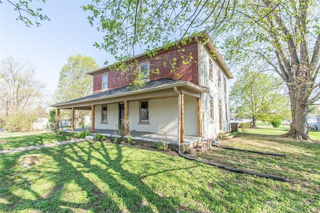 117 Montgomery Ave, Franklin, OH 45005 - view of front facade featuring a porch and a front lawn