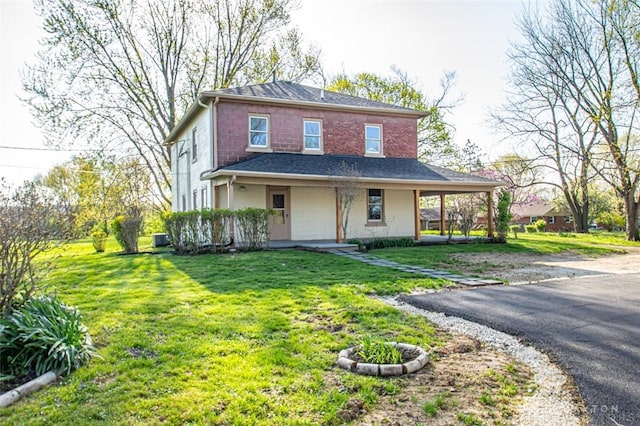117 Montgomery Ave, Franklin, OH 45005 - view of front of property with central AC, a front lawn, and covered porch